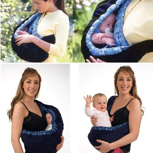 Newborn cross-body baby harness carrier with blue patterned lining, padded straps, and buckle