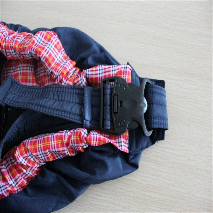 Newborn cross-body baby harness strap in dark fabric with red plaid lining and buckle