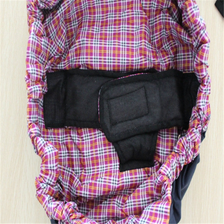 Newborn cross-body baby harness strap with red plaid outer, black center panel, and padding