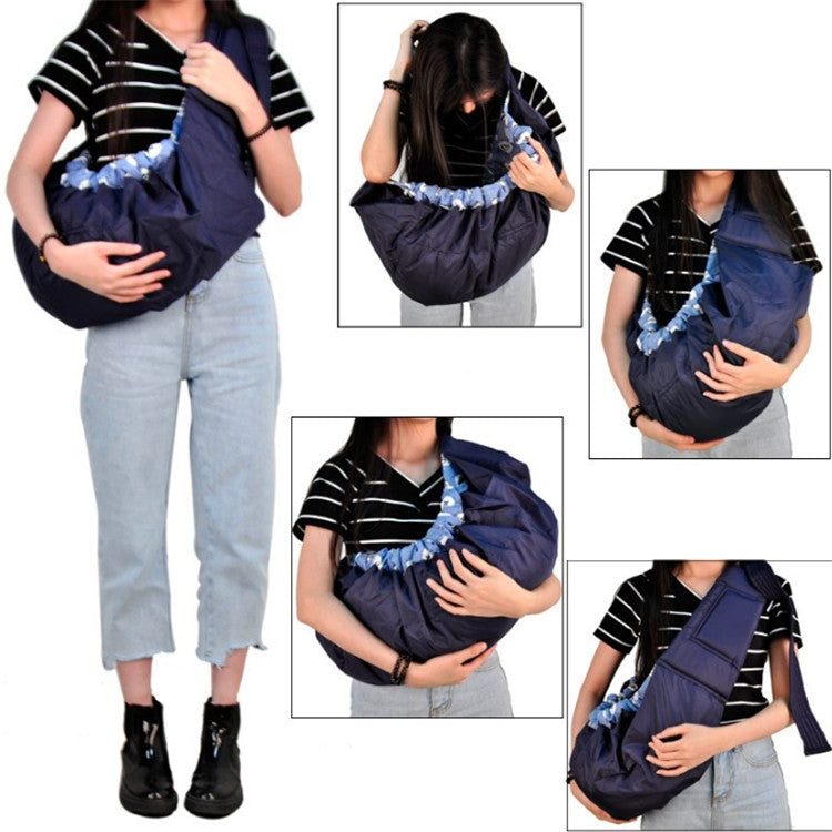Newborn cross-body baby harness strap worn on person with blue patterned lining and padded belt
