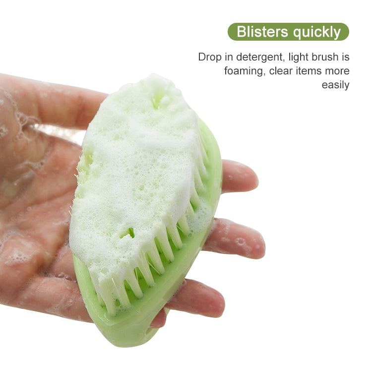 Green handheld cleaning brush with foam on the bristle head