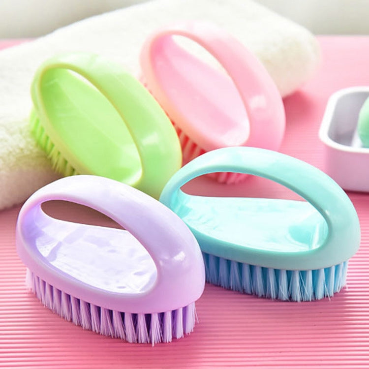 Colorful set of handheld cleaning brushes with pink, purple, green, and teal handles
