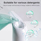 White automatic soap dispenser pouring clear liquid from the spout