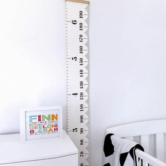 Kids height growth chart wall ruler with white tape, black numbers, wooden top