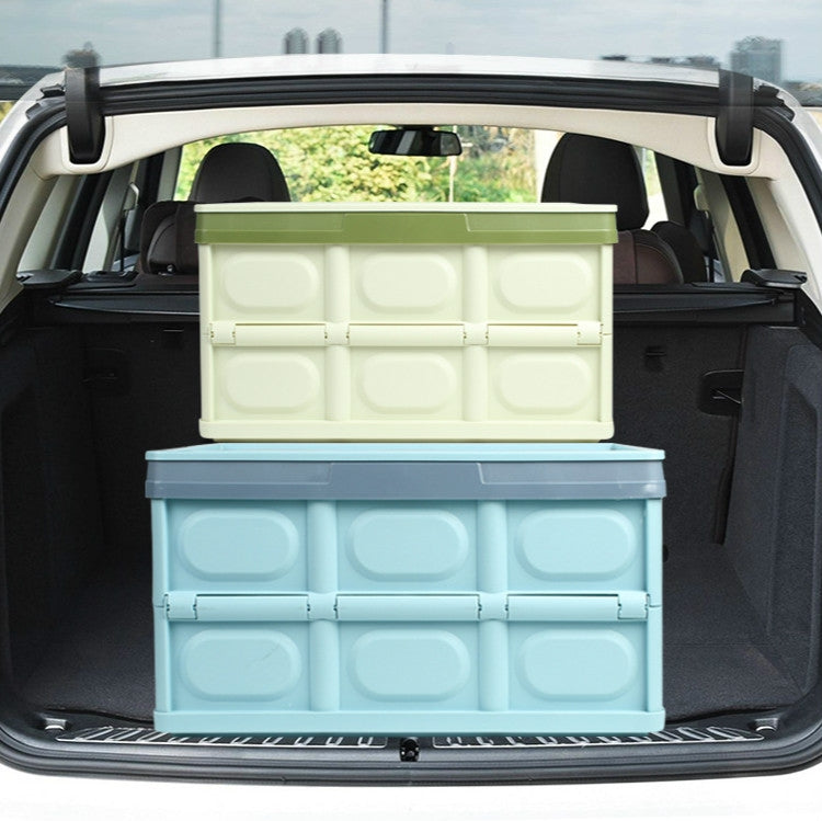 Foldable trunk storage box stacked in a car cargo area with hinged compartments