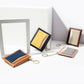 Mini card wallets on display with blue and pink slots and gold chain keyrings