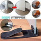 Black spring door stopper wedge with raised ends and textured surface
