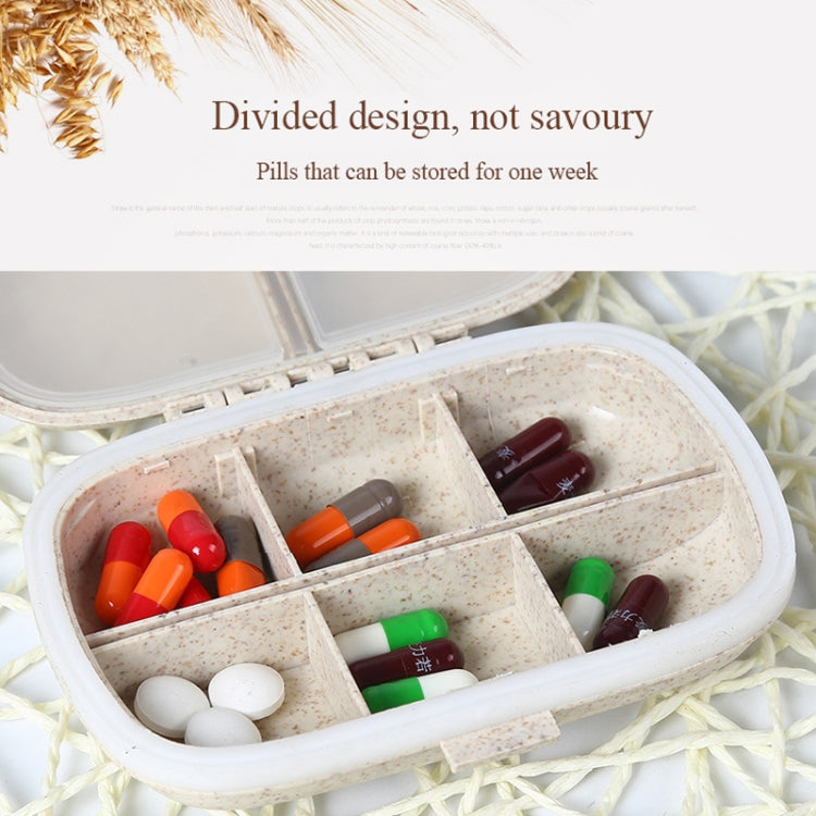 Mini straw pill storage box with divided grid holding colorful pills and tablets