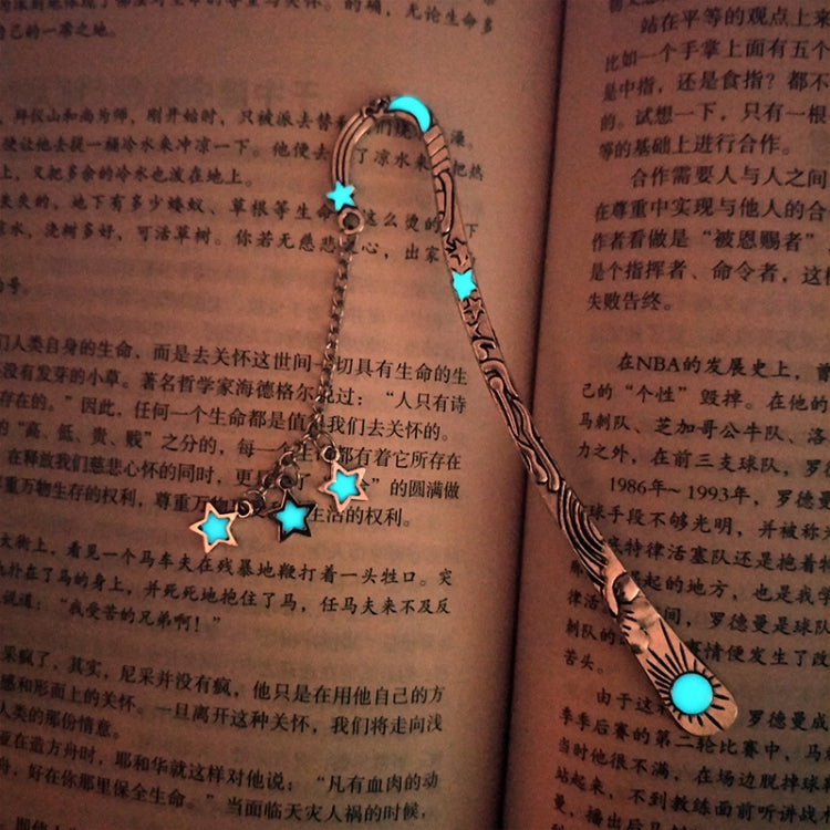Glowing blue star bookmark chain on open book page