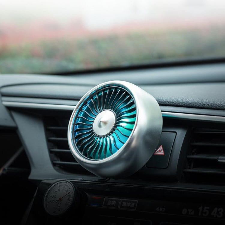 Silver car mini USB fan with blue LED airflow ring on car dashboard
