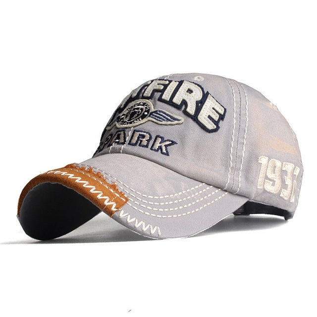 Gray baseball cap with embroidered FIRE patch, ARK text, 1974 detail, stitched brim