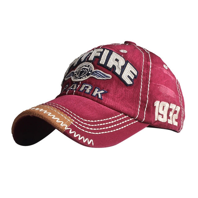 Wine red baseball cap with embroidered FIRE patch, ARK text, 1972 detail, stitched brim