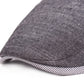 Close-up of dark gray cotton-linen beret brim with striped edge trim