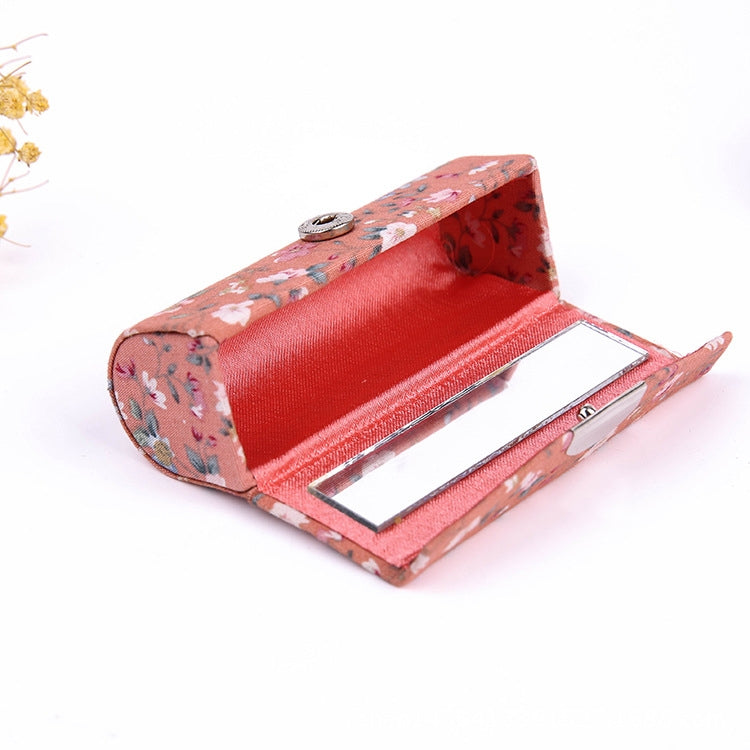 Peach floral mini makeup mirror case, open with built-in mirror panel