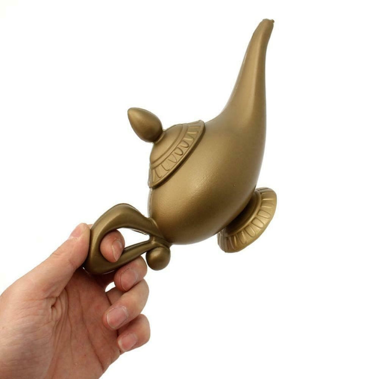 Gold plastic magic lamp prop held in hand, pointed lid and curled side handle