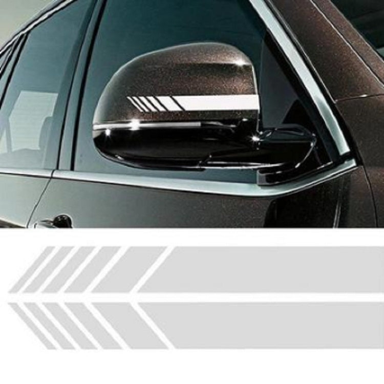 Rearview mirror sticker strip on car mirror, white backing with black diagonal stripes