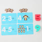 Math number tiles for a monkey balance scale toy with blue cards and small monkey pieces