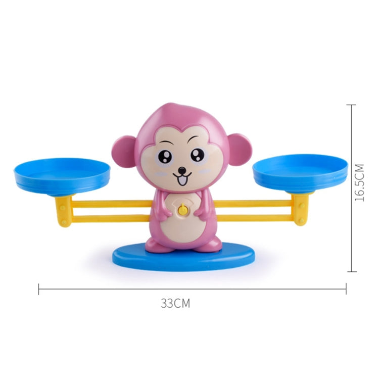 Pink monkey balance scale toy on round base with two blue platforms and yellow frame