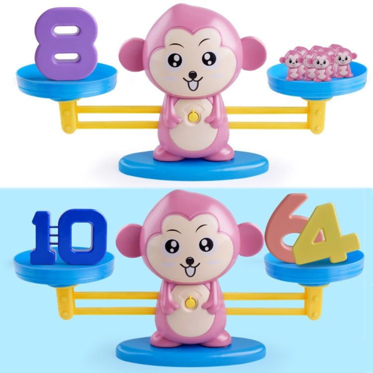 Pink monkey balance scale toy with large foam number pieces on blue platforms