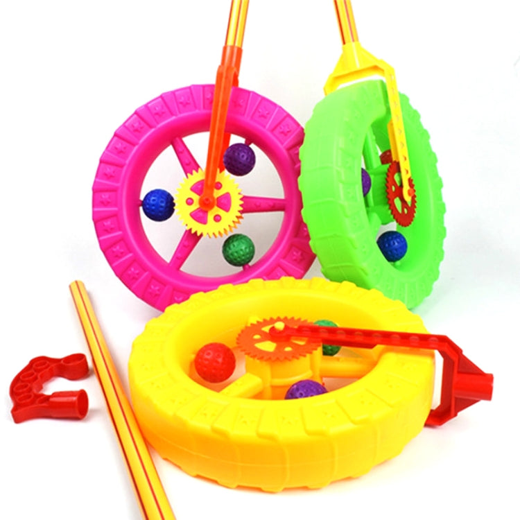 Play walker toy with pink and yellow wheels, green side wheel, and colorful gears