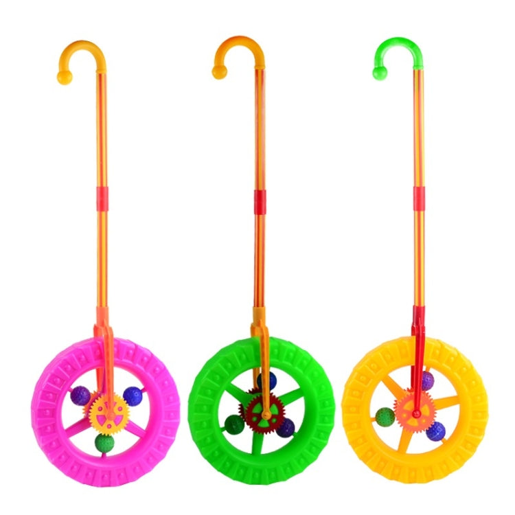 Set of three plastic walker push toys with purple, green, and yellow spinning wheels