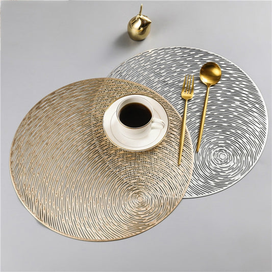 Set of 2 round PVC placemats: silver and gold with concentric swirl line pattern