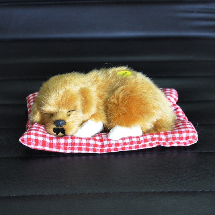Plush sleeping dog ornament toy, golden tan fur, in red plaid bed