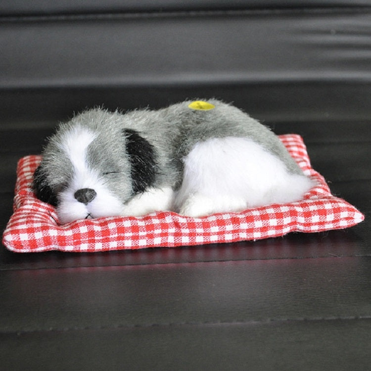 Plush sleeping dog ornament toy, gray and white fur, in red plaid bed