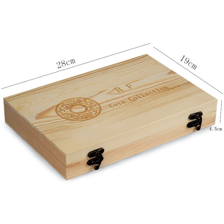 Wooden coin storage box with decorative emblem on lid and metal clasps