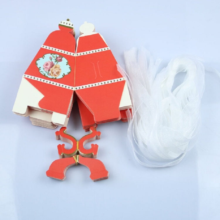 Red teapot-shaped candy box set with floral front panels and white tulle pouch