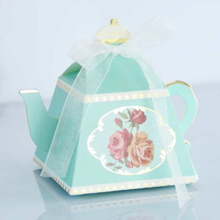 Light blue teapot-shaped candy box with floral front panel and sheer ribbon handle