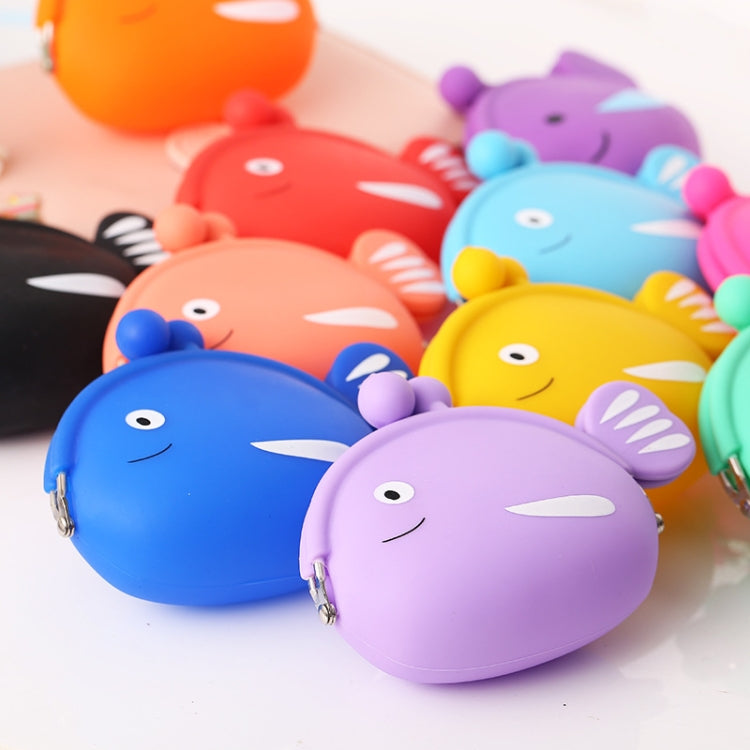Close-up of assorted silicone fish coin purses, including blue and purple faces