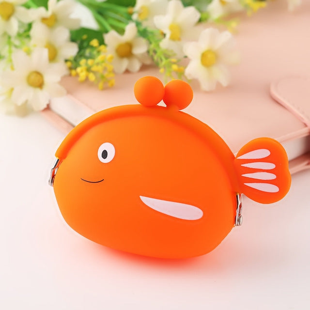 Orange fish-shaped silicone coin purse with cartoon face and side fin