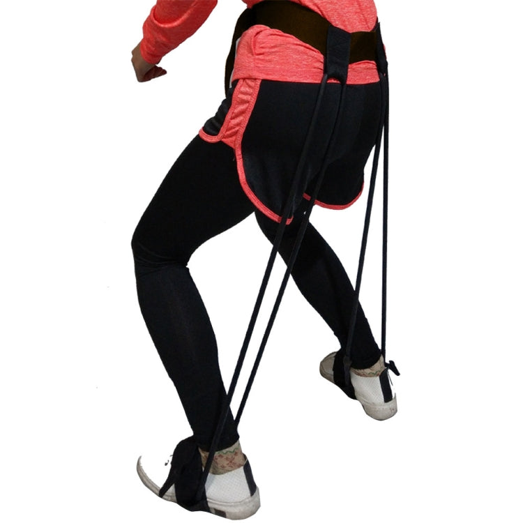 Leg stretch band worn with red elastic loops and black ankle straps