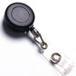 Retractable key chain clip with black round reel and clear badge holder, silver metal clasp