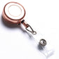 Retractable key chain clip in rose gold with clear badge holder and metal hook loop