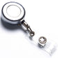 Retractable key chain clip with silver round reel, black cord, and clear badge holder