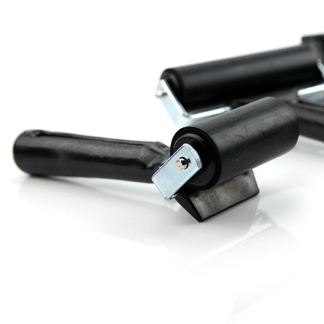 Handheld rubber ink roller tool with black roller and metal side mount