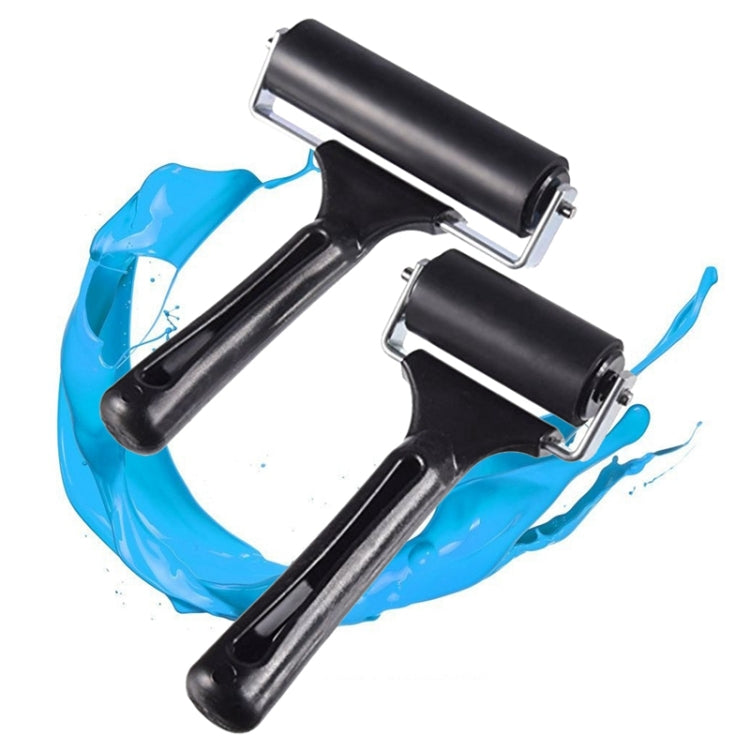 Black rubber ink roller printing tool with metal brackets, shown with blue ink