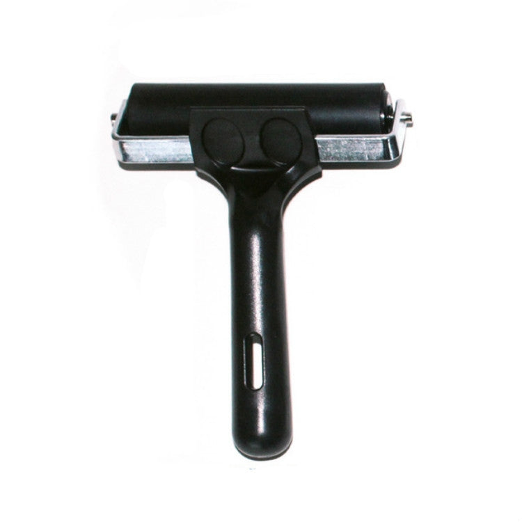 Black handheld printing roller tool with rubber roller and two-lug front support