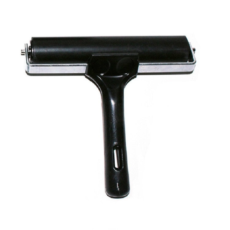 Black handheld ink roller printing tool with rubber roller and metal base plate