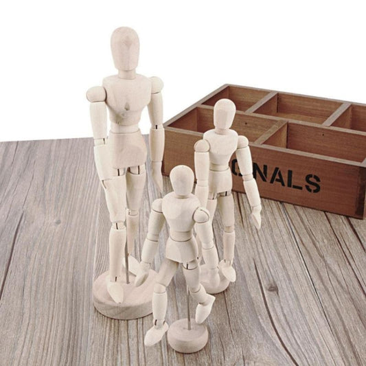 Wooden joint humanoid dolls posing on circular base with wooden crate