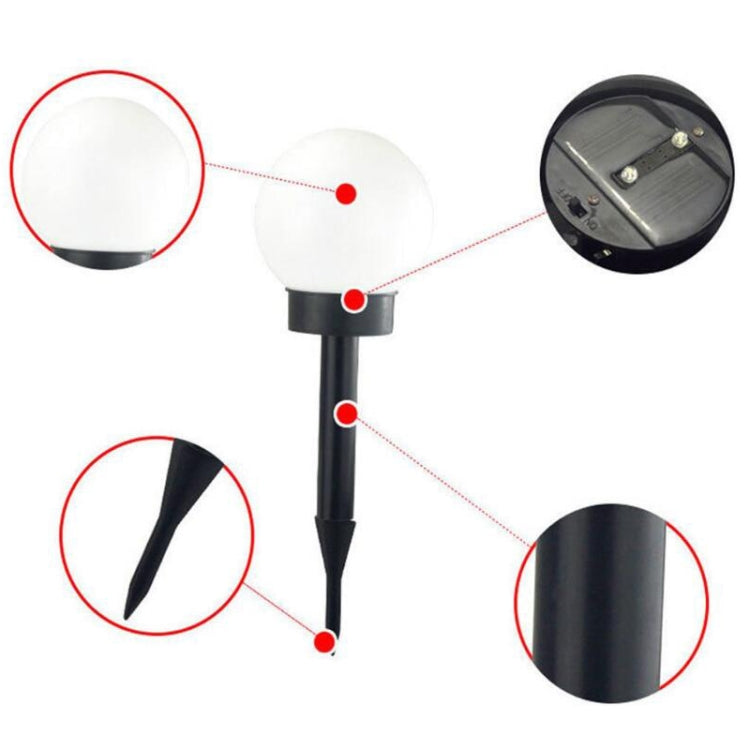 Solar ground light bulbs, close-up with bulb head, stake, and solar panel detail
