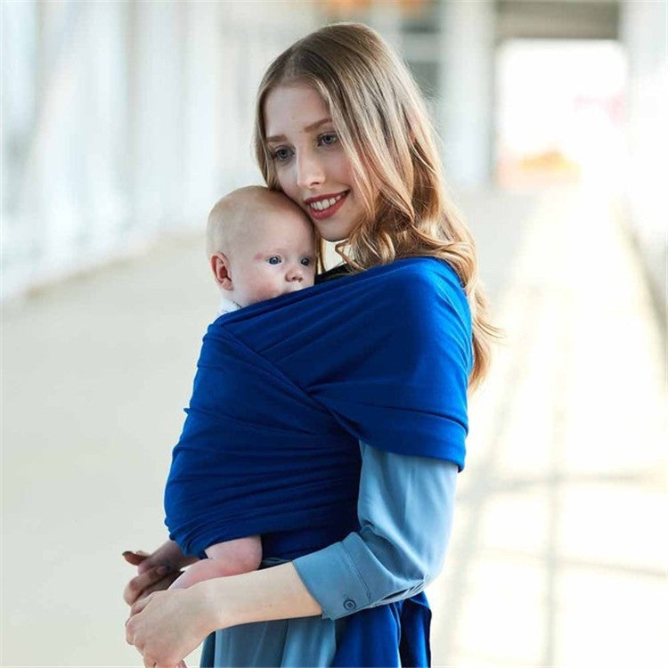 Infant multifunction sling in royal blue, front wrap carry with baby held on shoulder