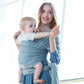 Infant multifunction sling in light grey, front carry with wrap gathered at waist