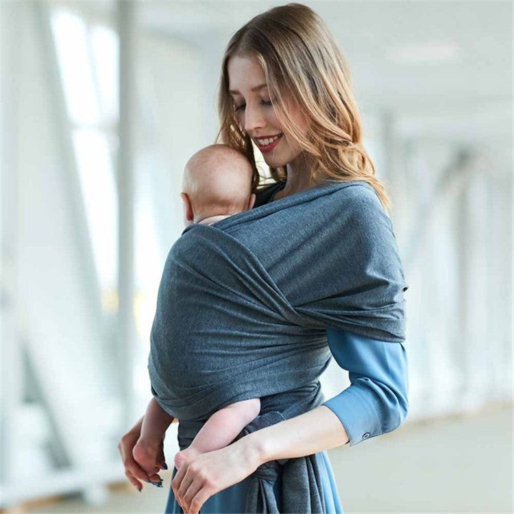 Infant multifunction sling in blue-grey, wrap around back with baby supported