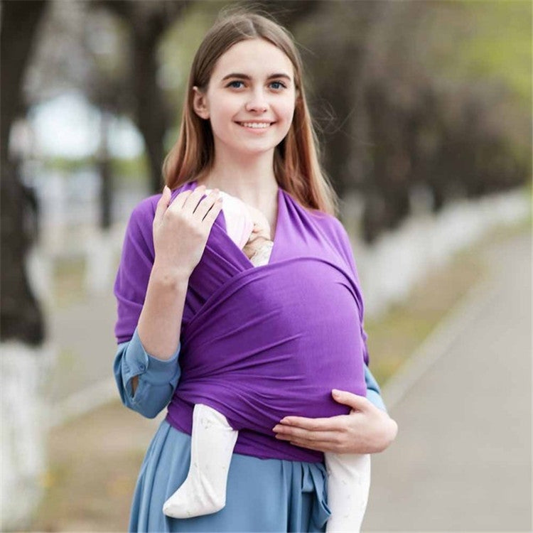 Infant multifunction sling in dark purple, wrap carry with baby nestled against chest