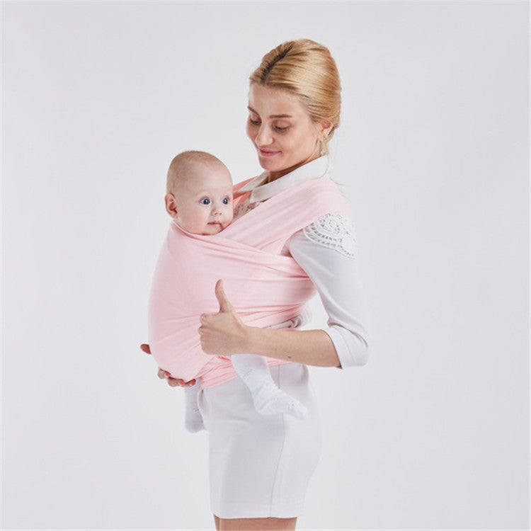 Infant multifunction sling in light pink, wrap carry with baby supported on shoulder