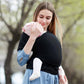 Infant multifunction sling in black, wrap carry with baby held securely