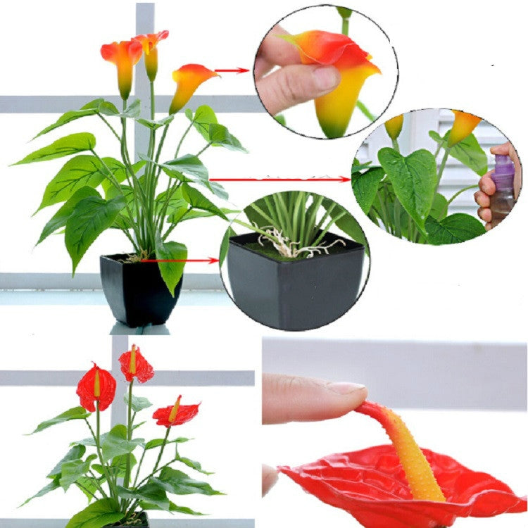 Artificial calla plant in black pot; orange-yellow blooms with green leaves, hand adjustment